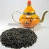 Losse orange pekoe thee met oosterse theepot op productpagina voor Oranje Pecco ontbijtthee online kopen.